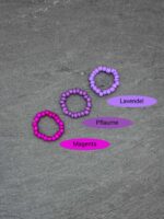 Set aus elastischen Perlenringen in mehreren bunten Farbvarianten