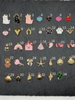 Verschiedene goldene Charms für DIY Charmarmband – Katze, Herz, Schleife, Stern, Muschel, Kleeblatt – personalisierbarer Schmuck zur Auswahl